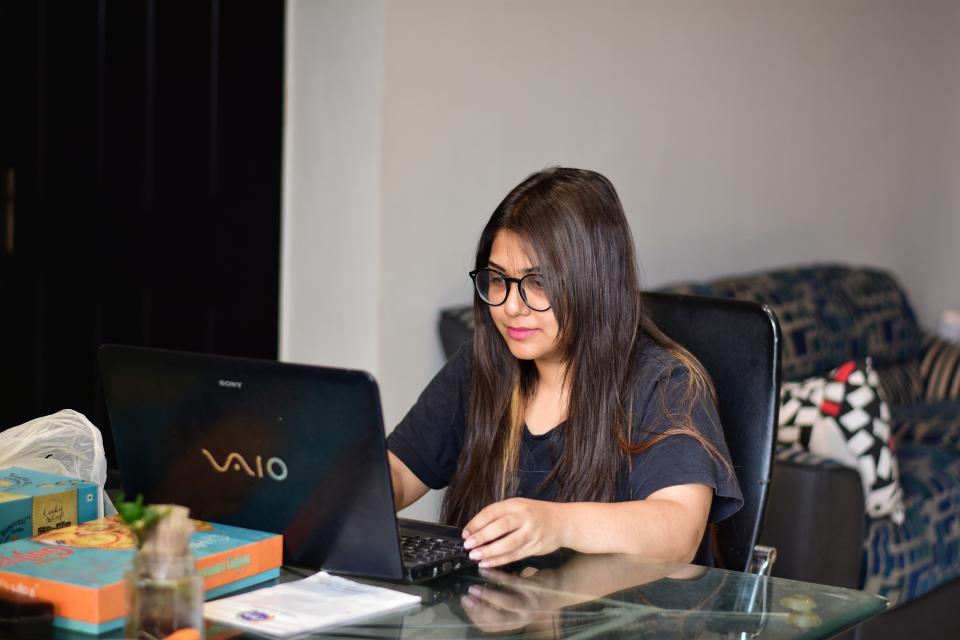 NOIDA, INDIA - 2020/03/21: In this photo illustration a female service employee working in Delhi and living in Noida works from home. With a rise in cases of Coronavirus, delhi government directs non-essential sectors to work from home till March 31 until further notice. (Photo Illustration by Manish Rajput/SOPA Images/LightRocket via Getty Images)