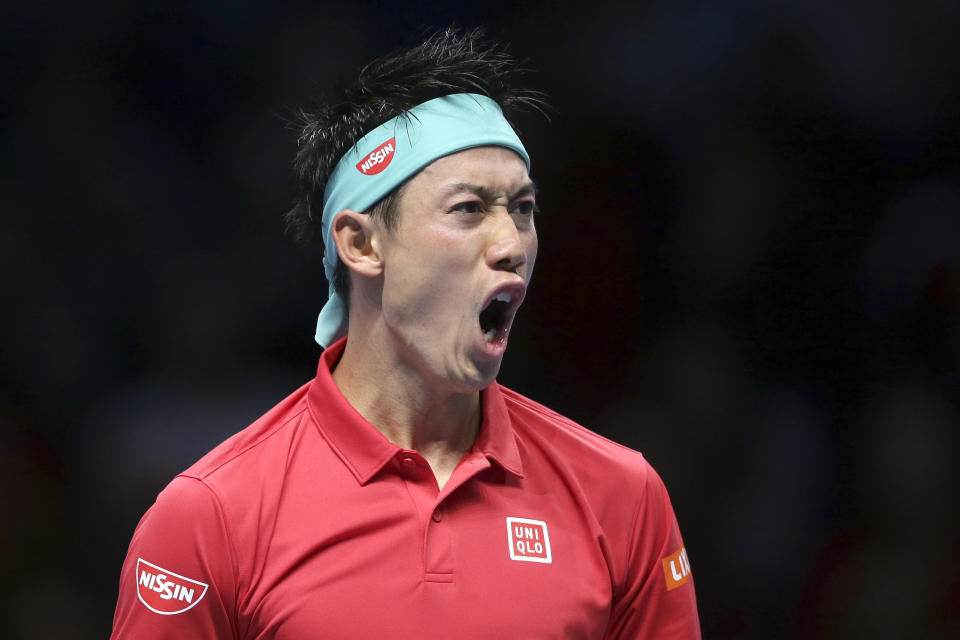 Japan's Kei Nishikori shouts after winning a point during his ATP World Tour Finals singles final tennis match against Switzerland's Roger Federer at the O2 Arena in London, Sunday Nov. 11, 2018. (AP Photo/Tim Ireland)