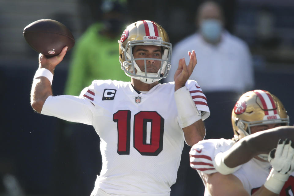 San Francisco 49ers quarterback Jimmy Garoppolo passes against the Seattle Seahawks during the first half of an NFL football game, Sunday, Nov. 1, 2020, in Seattle. (AP Photo/Scott Eklund)