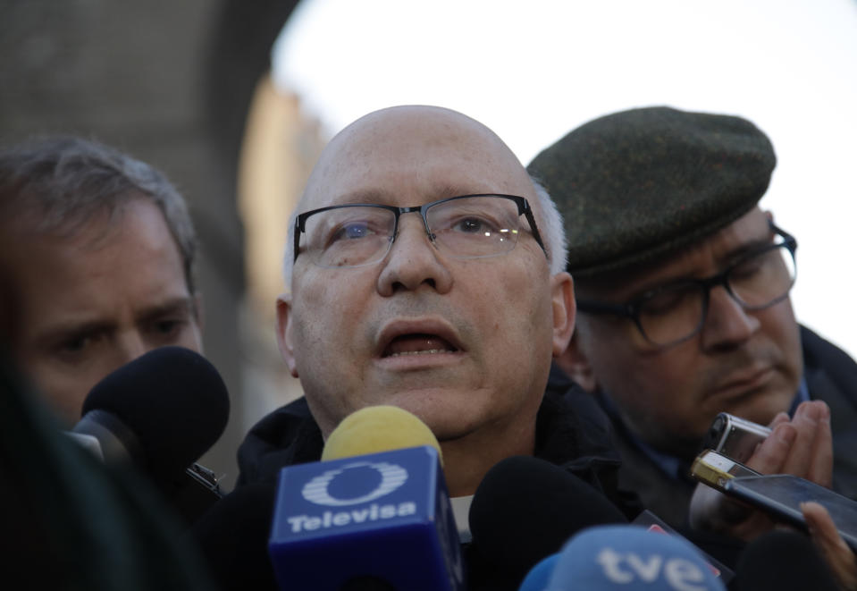 Bishop Fernando Ramos, Secretary General Episcopal Conference of Chile, receives media attention near the Vatican, in Rome Monday, Jan. 14, 2019. A delegation of Chilean bishops has met with Pope Francis a year after he threw his papacy into turmoil by defending a Chilean bishop accused of covering for a notorious sexual predator. (AP Photo/Alessandra Tarantino)