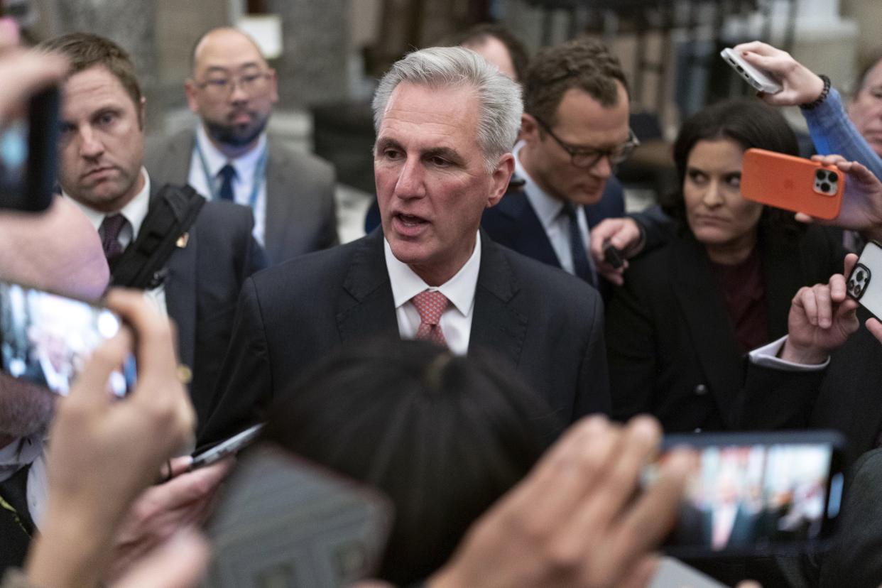 Rep. Kevin McCarthy, R-Calif., talks to reporters as he leaves the House of Representatives floor after the House voted to adjourn for the evening  on Thursday, Jan. 5, 2023.