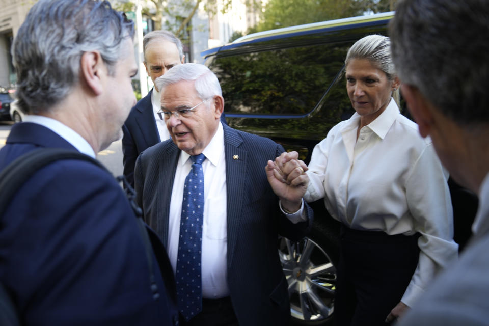 Democratic U.S. Sen. Bob Menendez of New Jersey and his wife Nadine Menendez arrive to the federal courthouse in New York, Wednesday, Sept. 27, 2023. Menendez is due in court to answer to federal charges alleging he used his powerful post to secretly advance Egyptian interests and carry out favors for local businessmen in exchange for bribes of cash and gold bars. (AP Photo/Seth Wenig)