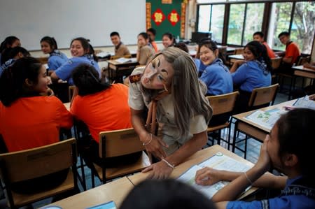 Teeraphong Meesat, 29, known as teacher Bally teaches English in a classroom at the Prasartratprachakit School in Ratchaburi Province