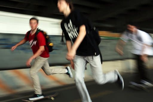 Teenagers skateboard along a shady underpass in New York City. Thirty-three percent of teens surveyed favored texting, while only 7% preferred a social networking site -- and in a sign of how times have changed, a mere 4% favored talking over the telephone