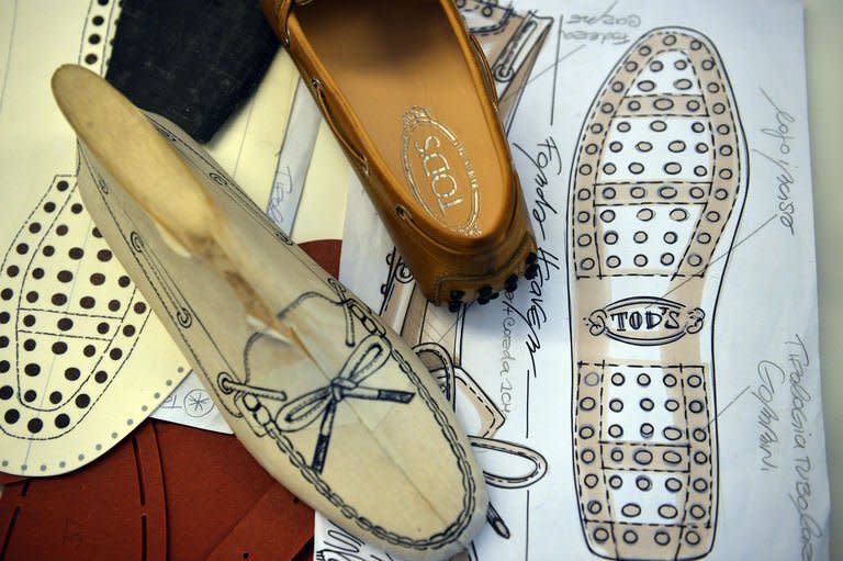 Drawings of moccasin prototypes are displayed in the workshop of the Italian shoes and luxury leather goods maker Tod's on May 27, 2013 in Casette d'Ete in the Italian Marche region