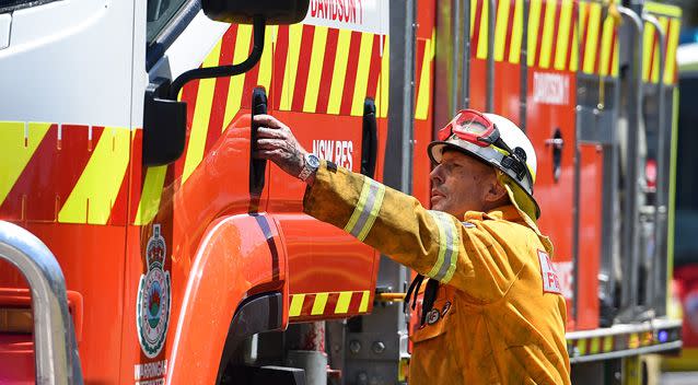 Mr Abbott has been a volunteer fire fighter for more than a decade. Photo: AAP