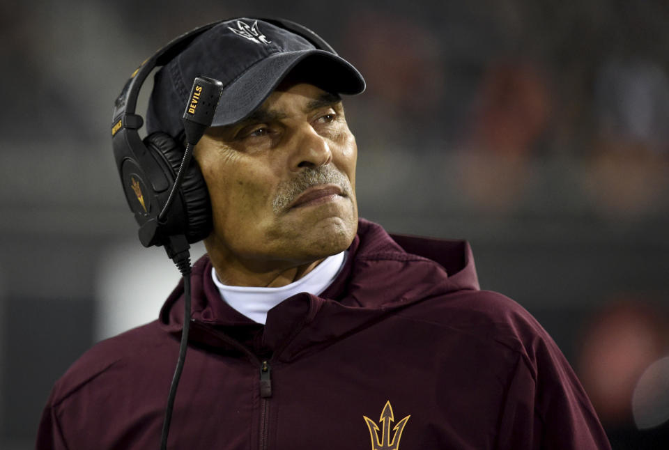 File-This Nov. 16, 2019, file photo shows Arizona State coach Herm Edwards watching from the sideline during the second half of the team's NCAA college football game against Oregon State in Corvallis, Ore. In 2003, the NFL had three minority head coaches: future Pro Football Hall of Famer Tony Dungy, Edwards and Marvin Lewis. In the 12 previous seasons, there had been six. Total. Considering that the majority of the players in the league 16 years ago were minorities, that imbalance was enormous. And disturbing. And, frankly, it was unfair. Paul Tagliabue, then the NFL commissioner, put together a committee that established the "Rooney Rule," which requires all teams with coaching and front office vacancies to interview minority candidates. The rule, long overdue, was named for Dan Rooney, then president of the Pittsburgh Steelers and the overseer of that committee. (AP Photo/Steve Dykes, File)