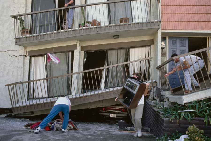 The clean-up begins of damage in the Van Nuys neighbourhood following the 1994 Northridge earthquake, which reached a magnitude of 6.7, in the San Fernando Valley region of the Los Angeles, California, 17th January 1994. With a duration of ten-to-twenty seconds, it was felt as far away as San Diego and Las Vegas. (Photo by Vinnie Zuffante/Getty Images)