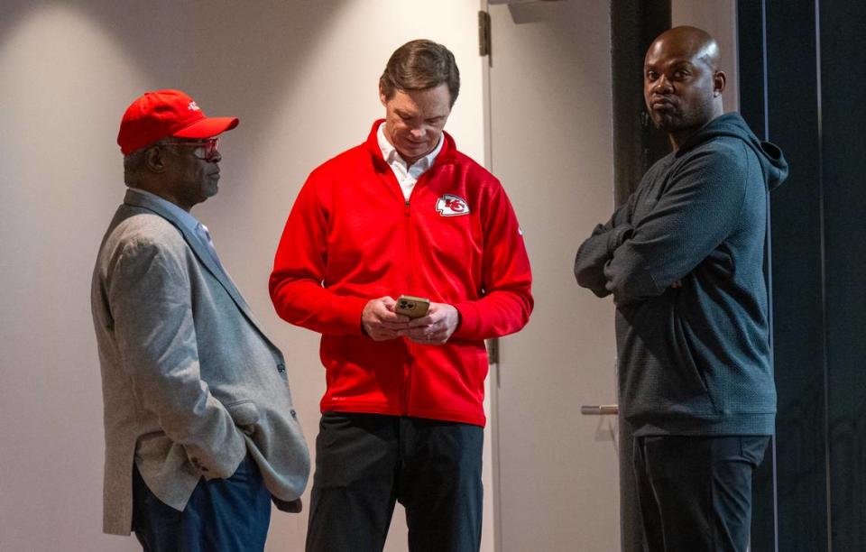 Sly James, former Kansas City mayor, from left, talks with Mark Donovan, President of the Kansas City Chiefs, who glanced at his phone and Ted Crews, Vice President of Communications) during a watch party at J. Rieger & Co., on Tuesday, April 2, 2024, for supporters of the 40-year, 3/8th-cent sales tax which will help pay for a new Royals stadium in the Crossroads and renovations to the Chiefs’ Arrowhead Stadium.