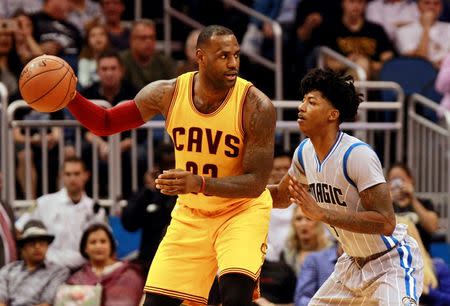 Dec 11, 2015; Orlando, FL, USA; Cleveland Cavaliers forward LeBron James (23) dribbles the ball as Orlando Magic guard Elfrid Payton (4) defends during the second half at Amway Center. The Cavaliers won 111-76. Mandatory Credit: Kim Klement-USA TODAY Sports