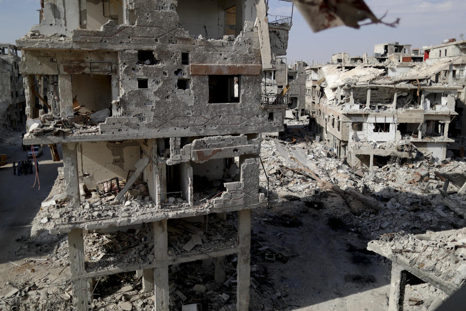 Buildings lie in ruins in the Palestinian refugee camp of Yarmouk in the Syrian capital Damascus, Syria, Saturday, Oct. 6, 2018. The camp, once home to the largest concentration of Palestinians outside the territories housing nearly 160,000 people, has been gutted by years of war. (AP Photo/Hassan Ammar)