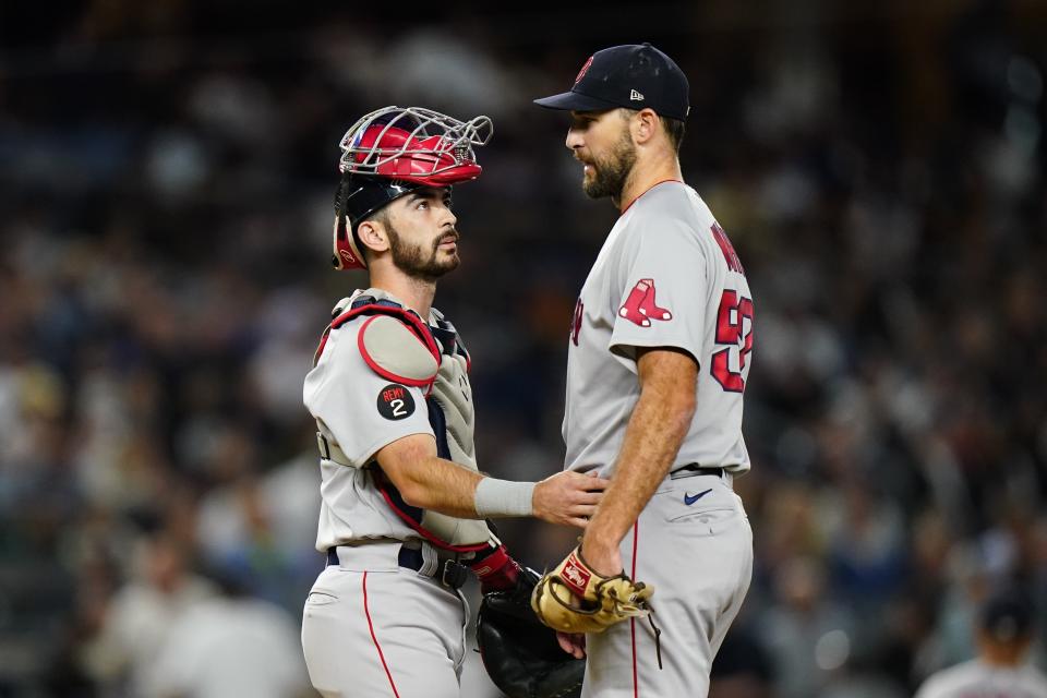 Boston Red Sox catcher Connor Wong, left, talks to starting pitcher Michael Wacha during the first inning of a baseball game against the New York Yankees Thursday, Sept. 22, 2022, in New York. (AP Photo/Frank Franklin II)