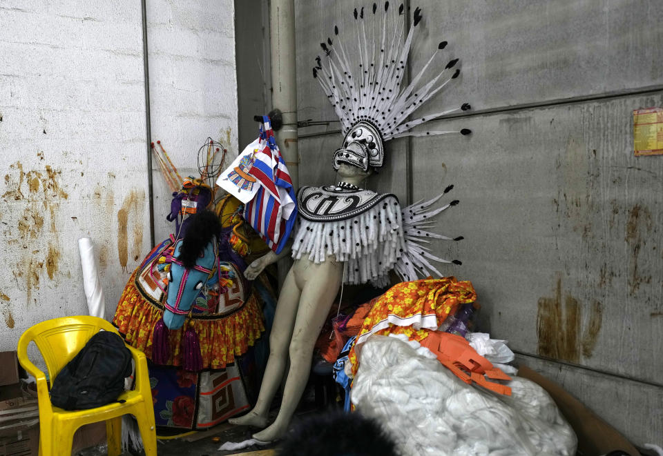 Costumes from the Paraiso do Tuiuti samba school are gathered on a corner at the Samba City complex in Rio de Janeiro, Brazil, Thursday, Feb. 9, 2023. Samba schools are already gearing up for Carnival, building the colorful floats and stitching together the costumes. (AP Photo/Silvia Izquierdo)