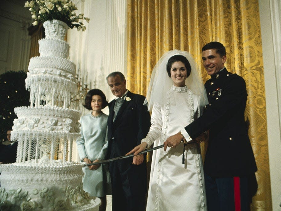 At Lynda Bird Johnson's White House wedding, the newlyweds cut the wedding cake with a sword.