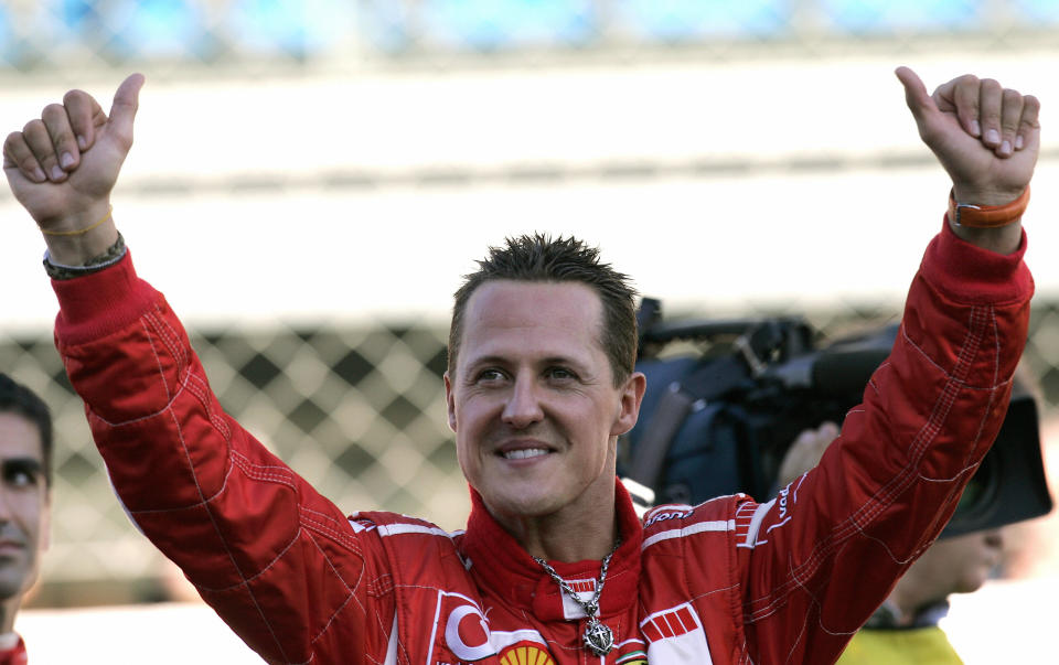 Former Ferrari driver Micheal Schumacher waves at fans. (Credit: Getty Images)