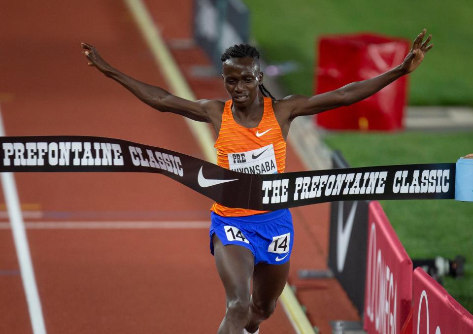 Francine Niyonsaba celebrates as she crosses the finish line to win the women’s 2-mile race at the 2022 Prefontaine Classic at Hayward Field in Eugene, Oregon Friday, May 27, 2022.