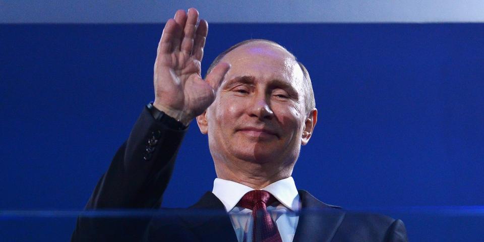 Russia President Vladimir Putin waves.