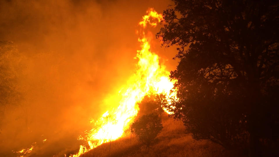 Wind-driven wildfires threatened homes in Northern California