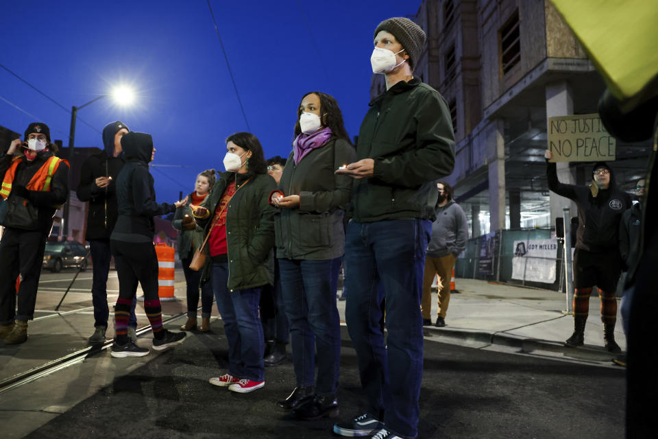 Protestors join a rally after the verdict was read during the trial of three Tacoma Police officers in the killing of Manny Ellis, at Pierce County Superior Court, Thursday, Dec. 21, 2023, in Tacoma, Wash. (AP Photo/Maddy Grassy)