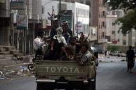 Armed Yemeni tribal gunmen from the Popular Resistance Committees loyal to fugitive President Abedrabbo Mansour Hadi, monitor a street in Taez during ongoing clashes on May 24, 2015