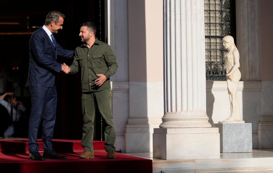 Kyriakos Mitsotakis, left, welcomed Volodymyr Zelensky at Maximos Mansion in Athens (AP)