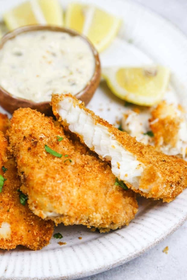 <p>Little Sunny Kitchen</p><p>Covered in a tasty crust, this air fryer fish remains soft and velvety. Ready in just 20 minutes!</p><p><strong>Get the recipe: <a href="https://littlesunnykitchen.com/air-fryer-fish/" rel="nofollow noopener" target="_blank" data-ylk="slk:Crispy Air Fryer Fish;elm:context_link;itc:0;sec:content-canvas" class="link ">Crispy Air Fryer Fish</a></strong></p>