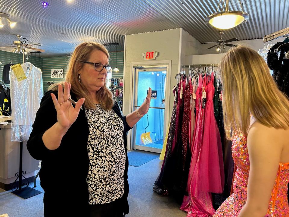 Abby Barndt with Barbara Walker, who appears to approve, in one of the many gowns Abby tried on Saturday.