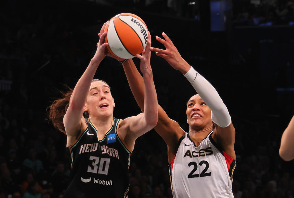 The Liberty's Breanna Stewart and the Aces' A'ja Wilson battle for the ball during during Game 3 of the 2023 WNBA Finals on Oct. 15, 2023, at Barclays Center in New York City. (Photo by Bruce Bennett/Getty Images)