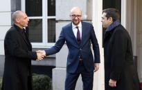 Belgian Prime Minister Charles Michel welcomes Greek Finance Minister Yanis Varoufakis (L) and Prime Minister Alexis Tsipras (R) ahead of a meeting in Brussels February 12, 2015. REUTERS/Francois Lenoir