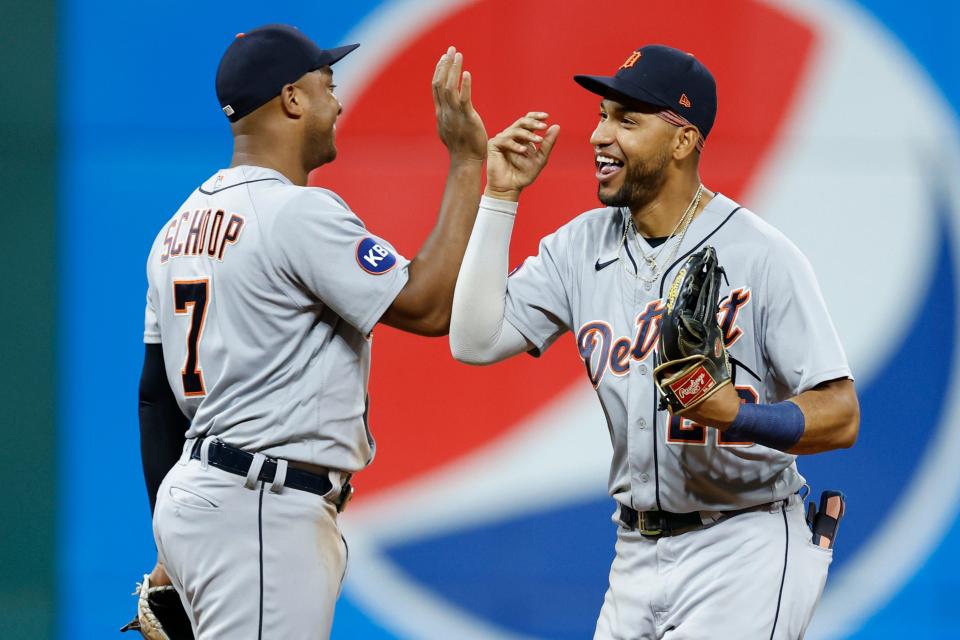 Tigers right fielder Victor Reyes, right, and second baseman Jonathan Schoop celebrate the 4-3 win over the Guardians on Tuesday, Aug. 16, 2022, in Cleveland.