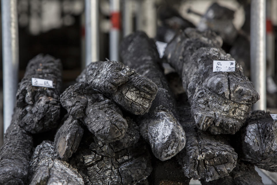 Charred debris is stored during preliminary work to repair the fire damage at the Notre-Dame de Paris Cathedral, in Paris, France, Wednesday, July 24, 2019. (AP Photo/Rafael Yaghobzadeh, Pool)