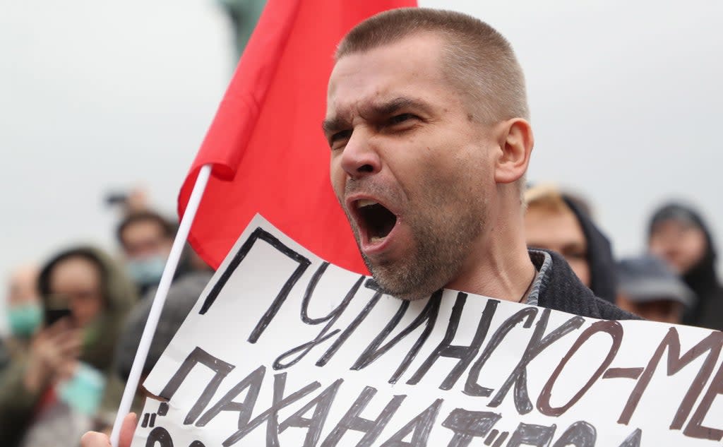 A Russian Communist party supporter at the protest against election fraud in Moscow on Saturday (EPA)