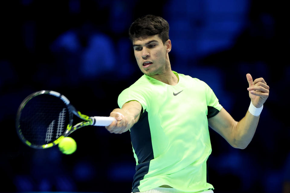 TURIN, ITALY - NOVEMBER 13: Carlos Alcaraz of Spain plays a forehand against Alexander Zverev of Germany during their Round Robin match on day two of the Nitto ATP Finals at Pala Alpitour on November 13, 2023 in Turin, Italy. (Photo by Giampiero Sposito/Getty Images)