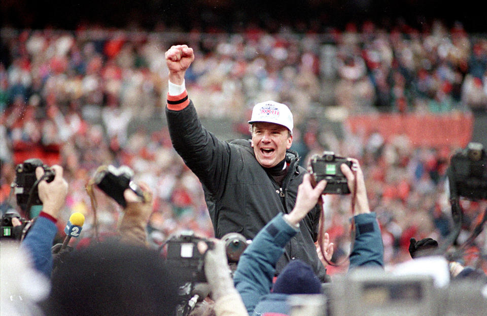 Cincinnati Bengals coach Sam Wyche is carried from the field on the shoulders of his players after their 21-10 victory over the Buffalo Bills for the AFC Championship game on Jan. 9, 1989. (AP Photo/Rob Burns)