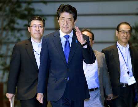 Japan's Prime Minister Shinzo Abe arrives at his official residence after an earthquake, in Tokyo