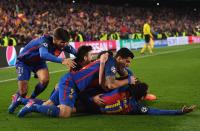 <p>Sergi Roberto of Barcelona (obscured) celebrates with team mates as he scores their sixth goal during the UEFA Champions League Round of 16 second leg match between FC Barcelona and Paris Saint-Germain at Camp Nou on March 8, 2017 in Barcelona, Spain. (Photo by Laurence Griffiths/Getty Images) </p>