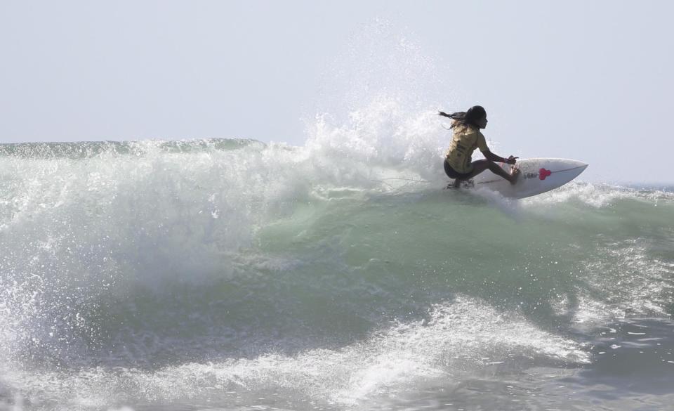 Katherine Díaz surfing off La Libertad, El Salvador.