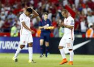 Wesley Sneijder (R) and Jairo Riedewald of the Netherlands react after their Euro 2016 Group A qualifying soccer match against Turkey in Konya, Turkey, September 6, 2015. REUTERS/Umit Bektas