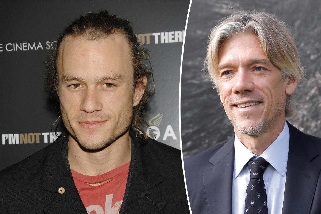 Heath Ledger smiling next to Stephen Gaghan.