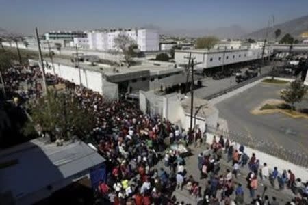 Family members of inmates gather outside the Topo Chico prison in Monterrey, Mexico, February 11, 2016. REUTERS/Daniel Becerril