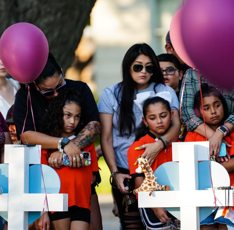 Mourners pay their respects on May 27, 2022, at a memorial for the children and teachers killed at Robb Elementary School in Uvalde, Texas, on May 24, 2022.