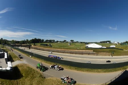 Jun 14, 2016; Oakmont, PA, USA; Automobiles go by on Interstate 76 splitting the Oakmont Country Club during the practice rounds on Tuesday of the 2016 U.S. Open golf tournament. Mandatory Credit: John David Mercer-USA TODAY Sports