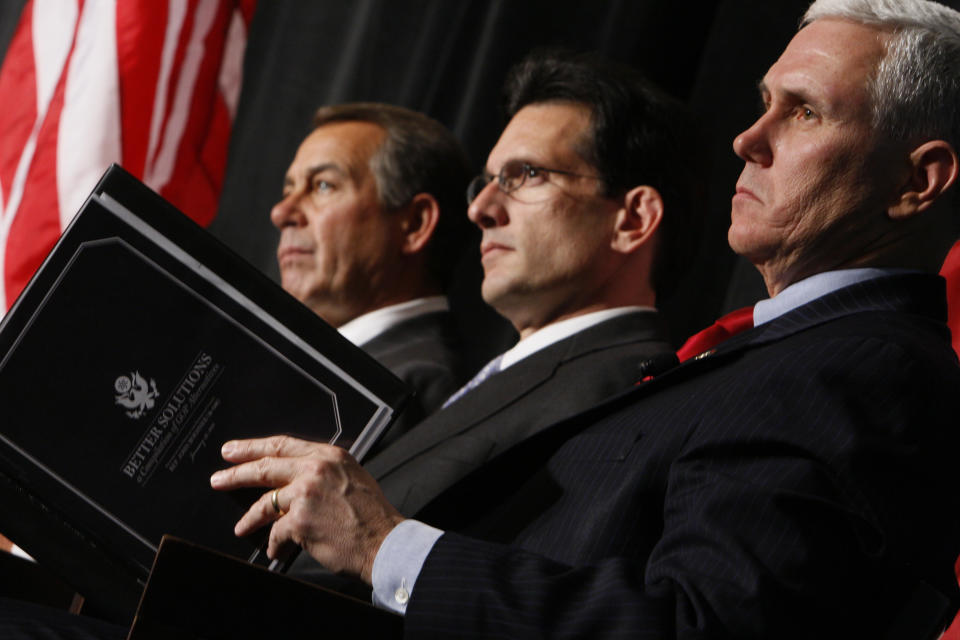 FILE - From left, House Minority Leader John Boehner of Ohio, House Minority Whip Eric Cantor of Va., and Rep. Mike Pence, R-Ind., listen as President Barack Obama speaks to Republican lawmakers at the GOP House Issues Conference in Baltimore, Jan. 29, 2010. As Mike Pence approaches a likely 2024 run for president, he's opening up to audiences about the parts of his career before he served as Donald Trump's vice president. He hopes his 12 years in Congress and four years as Indiana governor will project the record of a conservative fighter. (AP Photo/Charles Dharapak, File)