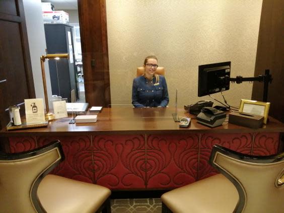 Reception desks have plastic screens (Helen Coffey)