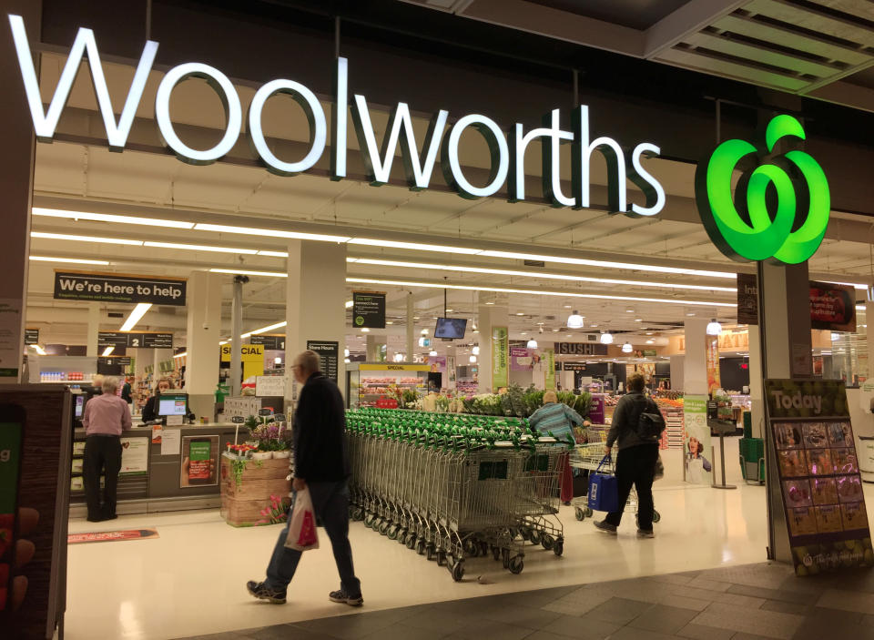 Woolworths store front with customers and trolleys. Source: Reuters/Jason Reed