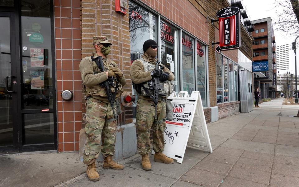 National guard soldier are posted on a street corner near downtown as the city prepares for reaction to the verdict - Scott Olson /Getty