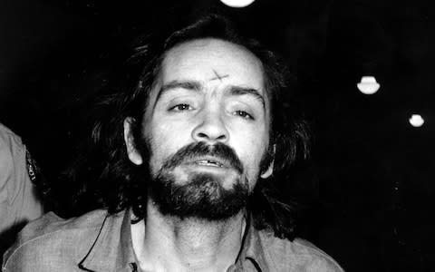 Charles Manson heads for court in Los Angeles on August 6, 1970  - Credit: AP
