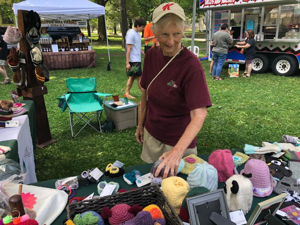 Robin Kellogg of Kellogg's Alpacas presents some of the hand-made alpaca products she brought to the Alfred Farmers Market on July 23.