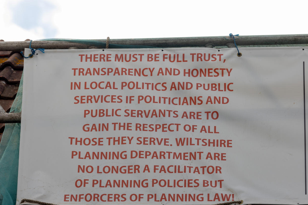 Michael Thomas previously erected a banner protesting against Wiltshire Planning Department. (SWNS)