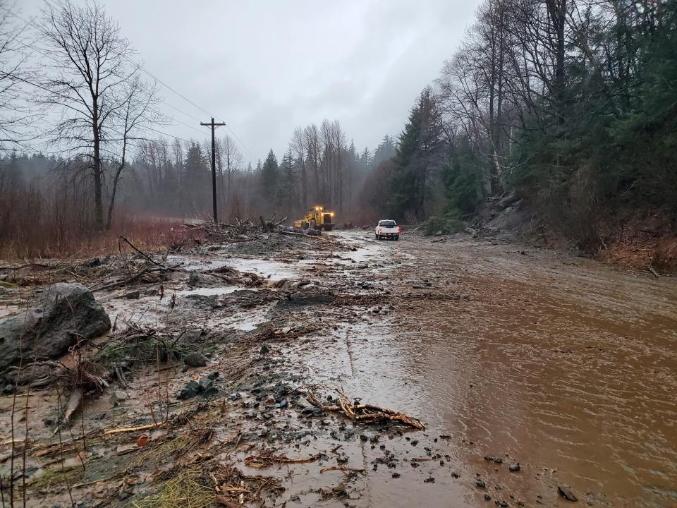 This photo provided by the Alaska Department of Transportation and Public Facilities shows damage from heavy rains and a mudslide 600 feet wide in Haines, Alaska, on Wednesday, Dec. 2, 2020. Authorities say six people are unaccounted for, and four homes were destroyed in the slide, with the search resuming Thursday morning for survivors. (Matt Boron/Alaska Department of Transportation and Public Facilities via AP)